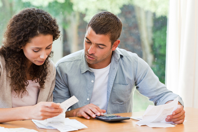 Bigstock Young Couple Calculating Their 13876250